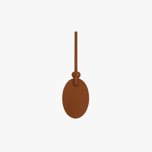 Butterscotch | Front view of Monos x Reformation Luggage Tag in Butterscotch color