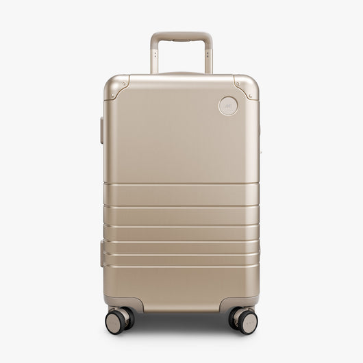Champagne Gold | Front view of Aluminum Carry-On Plus in Champagne Gold