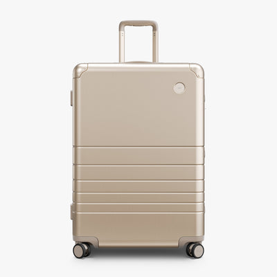 Champagne Gold | Front view of Aluminum Check-In Large in Champagne Gold