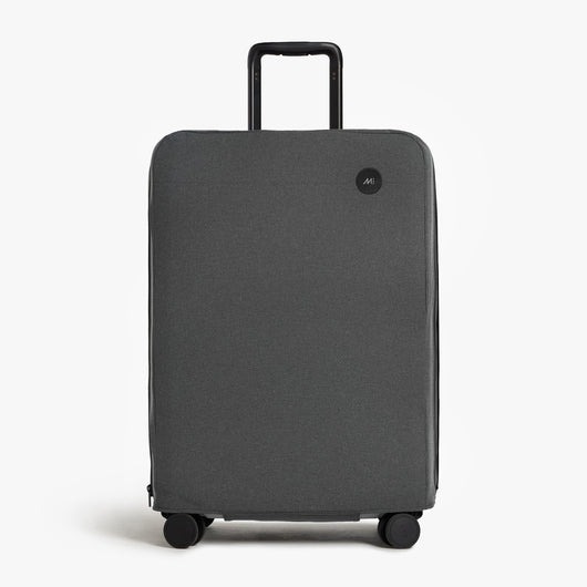 Expandable Check-In Medium | Front view of Expandable Check-In Medium Washable Luggage Cover in grey